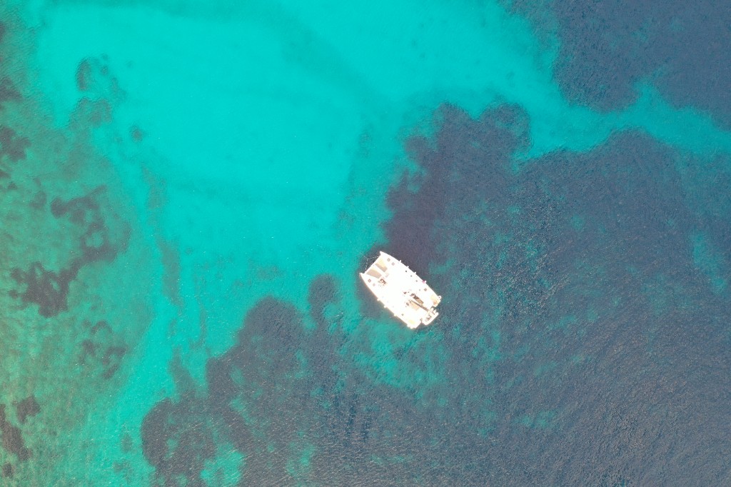 Catamaran over clear water