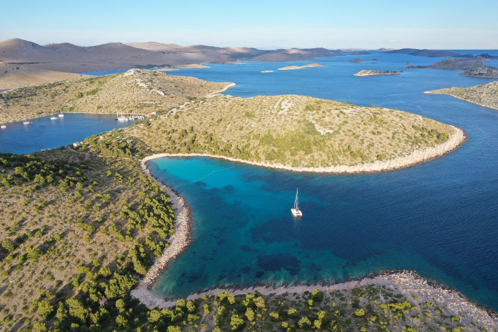 Yacht in a turquoise cove